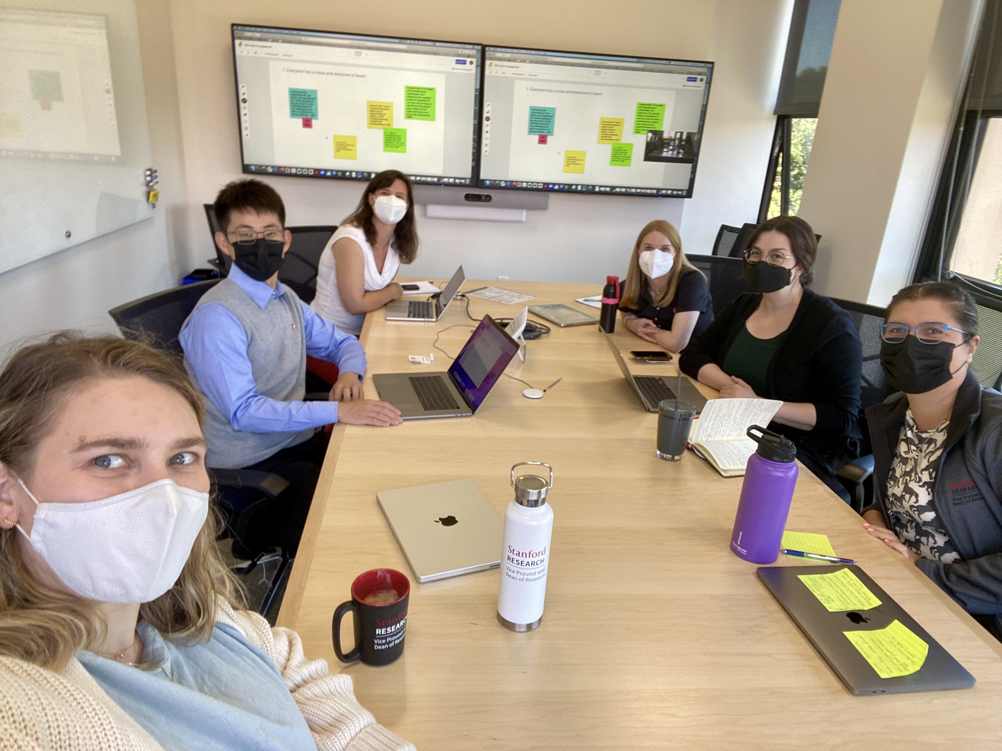 RDO team around conference table, wearing masks
