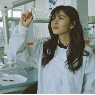 lab technician inspecting vial